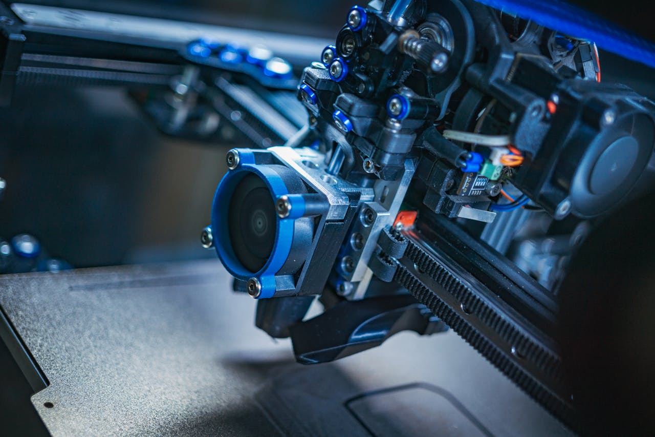 Detailed view of a high-tech 3D printer mechanism showcasing precision engineering.